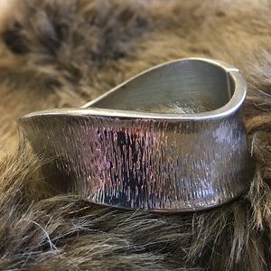 Textured silver tone wavy style clamp bracelet
